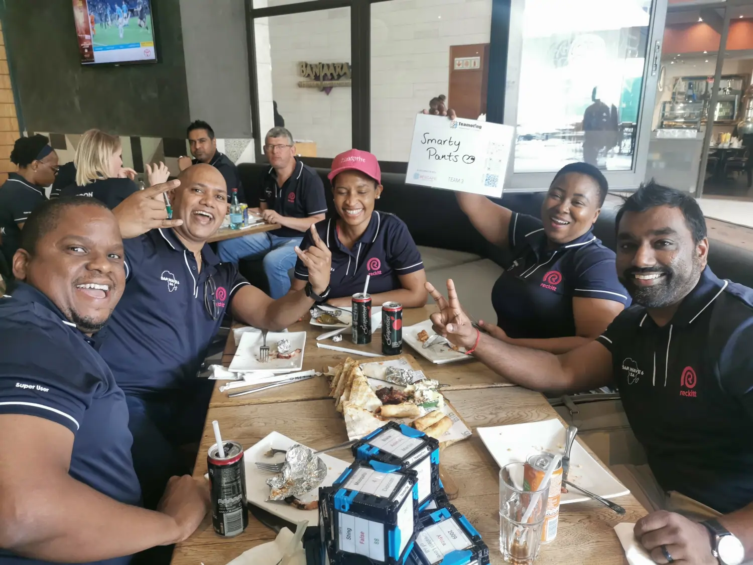 The "Smarty Pants" team from Reckitt laughing and celebrating during a team building event at Salsa Mexican Grill in Bedford Centre